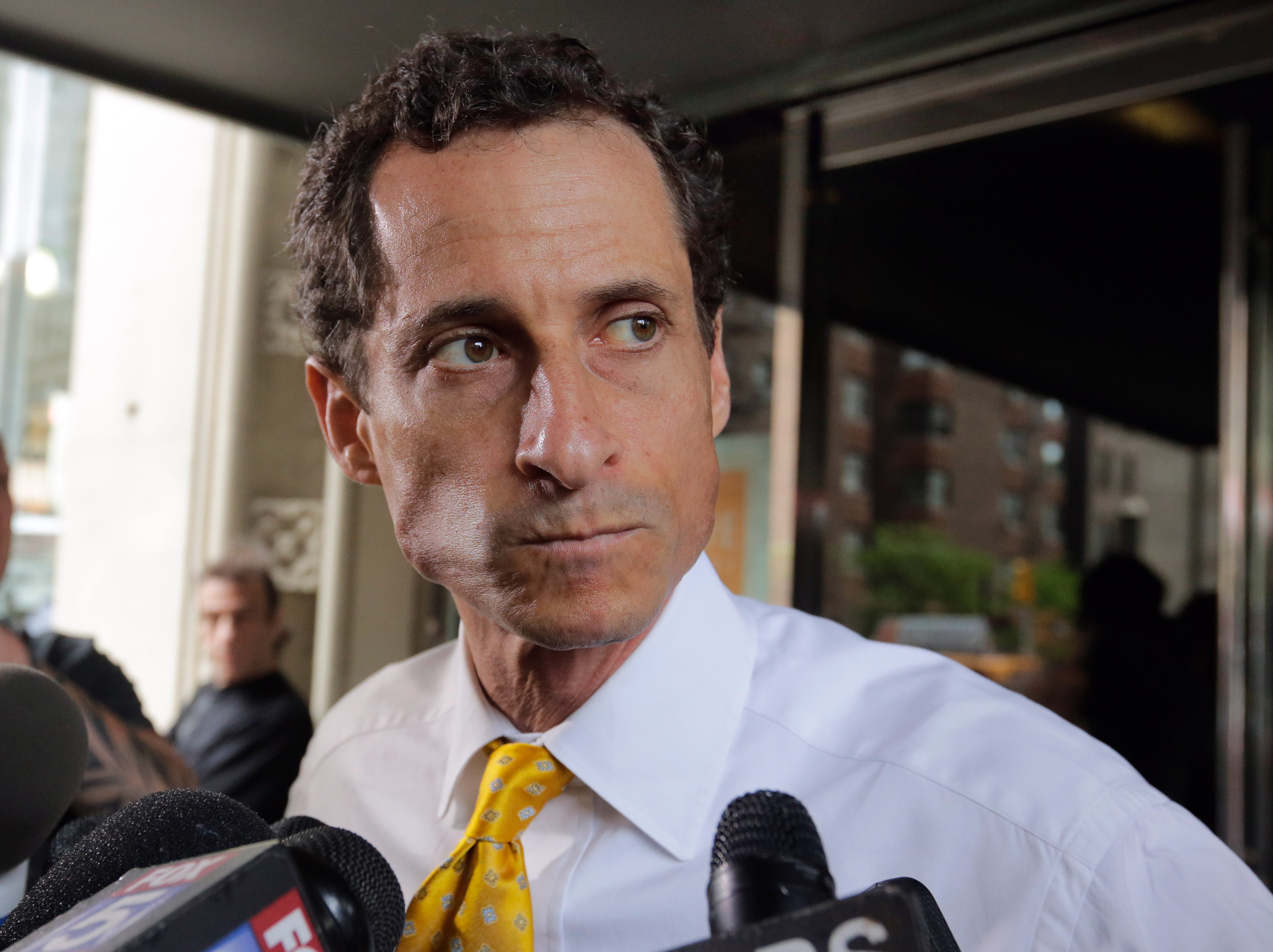 Former U.S. Congressman and current New York mayoral candidate Anthony Weiner leaves his apartment building, in New York, Wednesday, July 24, 2013. On Tuesday Weiner made a public mea culpa for a newfound sexting scandal that erupted amid the mayoral run he hopes will rewrite his political future. (AP Photo/Richard Drew)